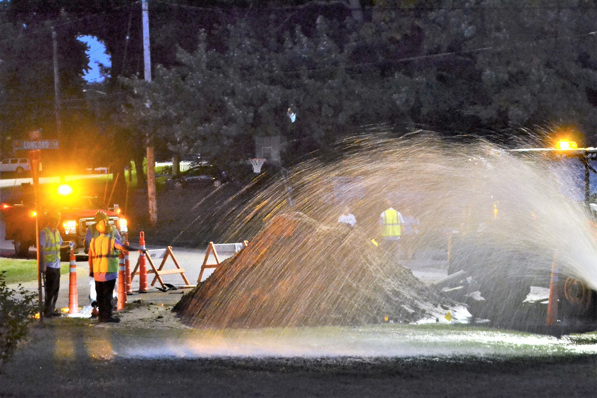 City employees repairing a water leak